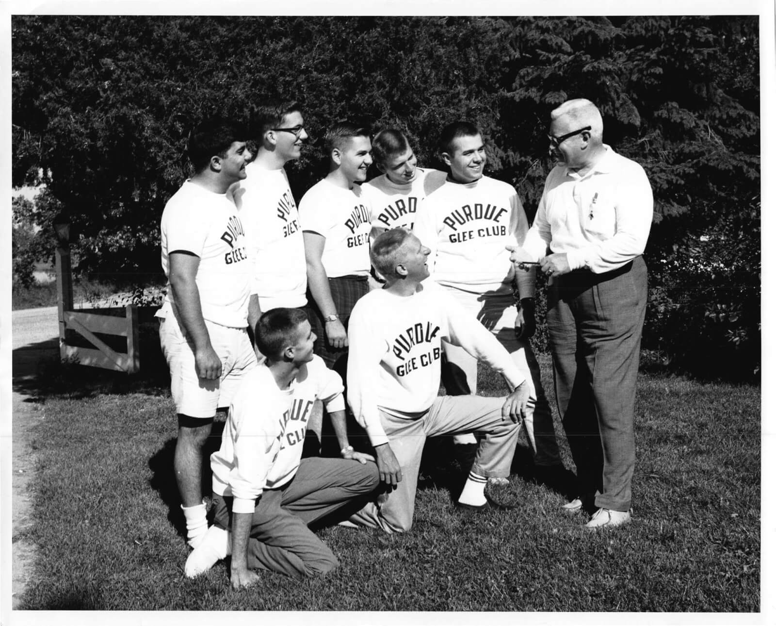 Members of the Purdue Varsity Glee Club and Delta Upsilon with director Albert P. Stewart
in the 1960s. Author Author Angie Klink’s brother Dennis D. Lipp is on bended
knee in front of Stewart.