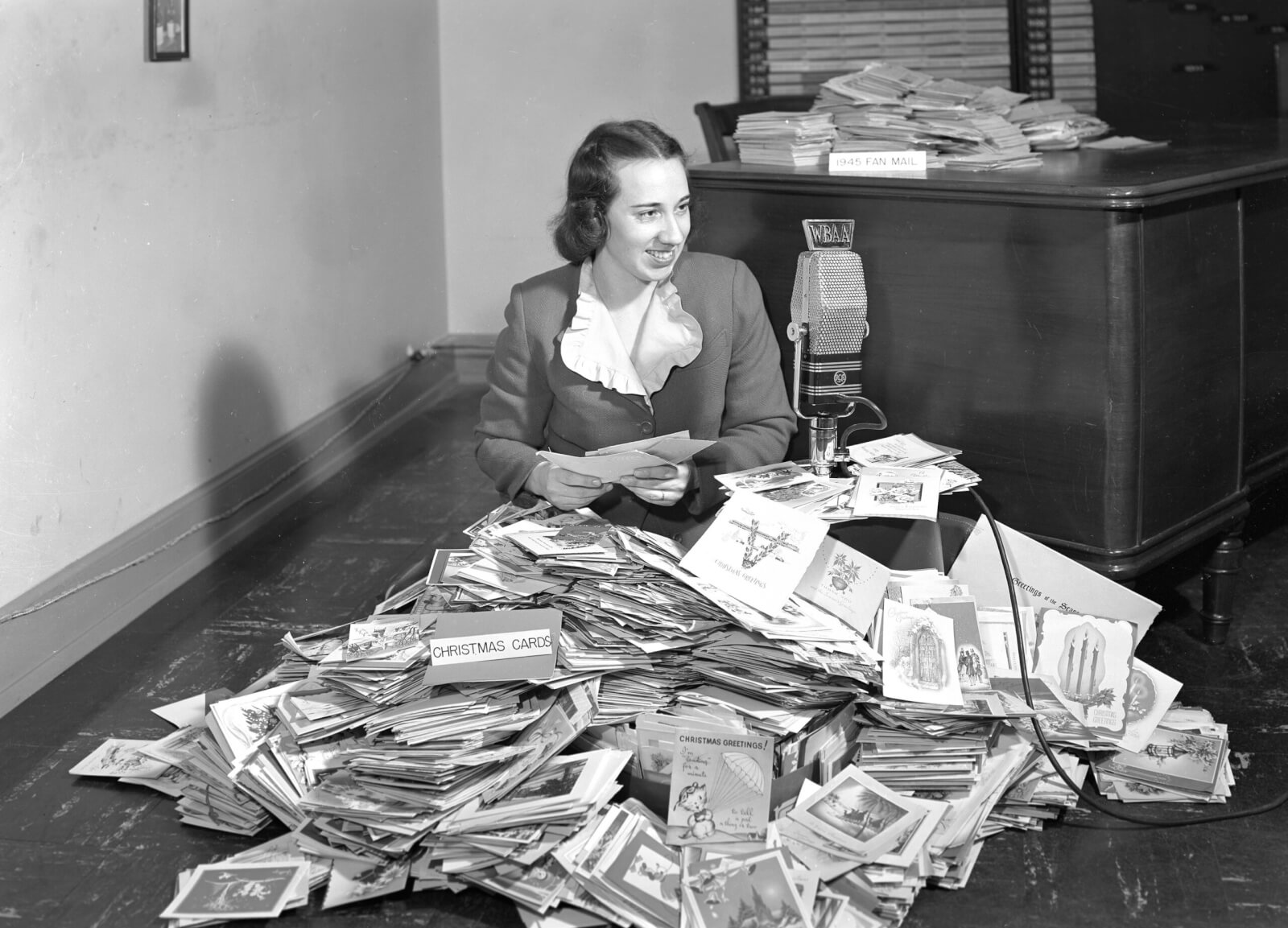 Virginia Berry Clark with huge outpouring of Christmas Cards from WBAA fans, 1946.